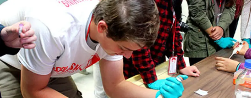 Students from Cornell’s synthetic biology team lead a chemistry class at Splash